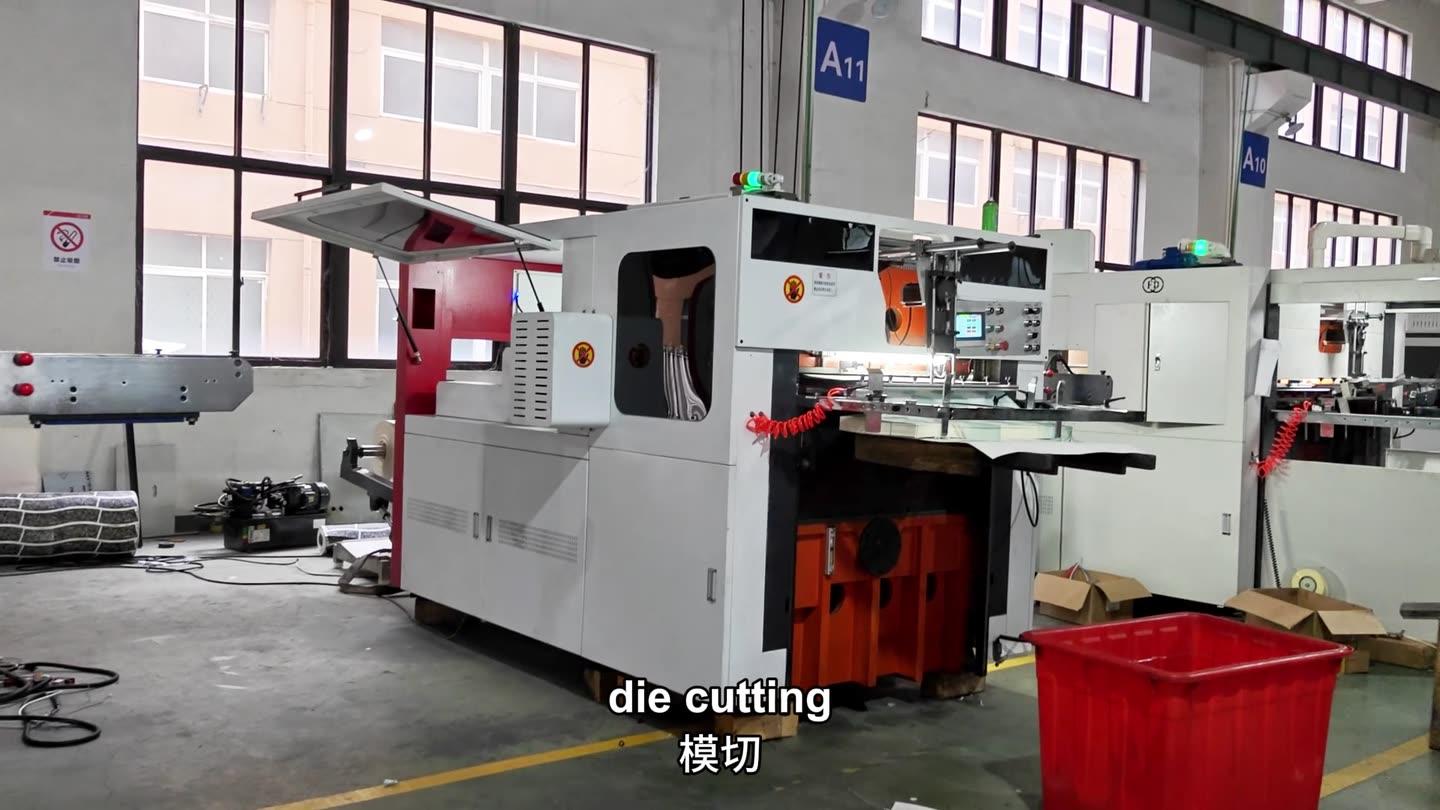 Die cutting machine cutting the printed roll paper into paper cup fans
