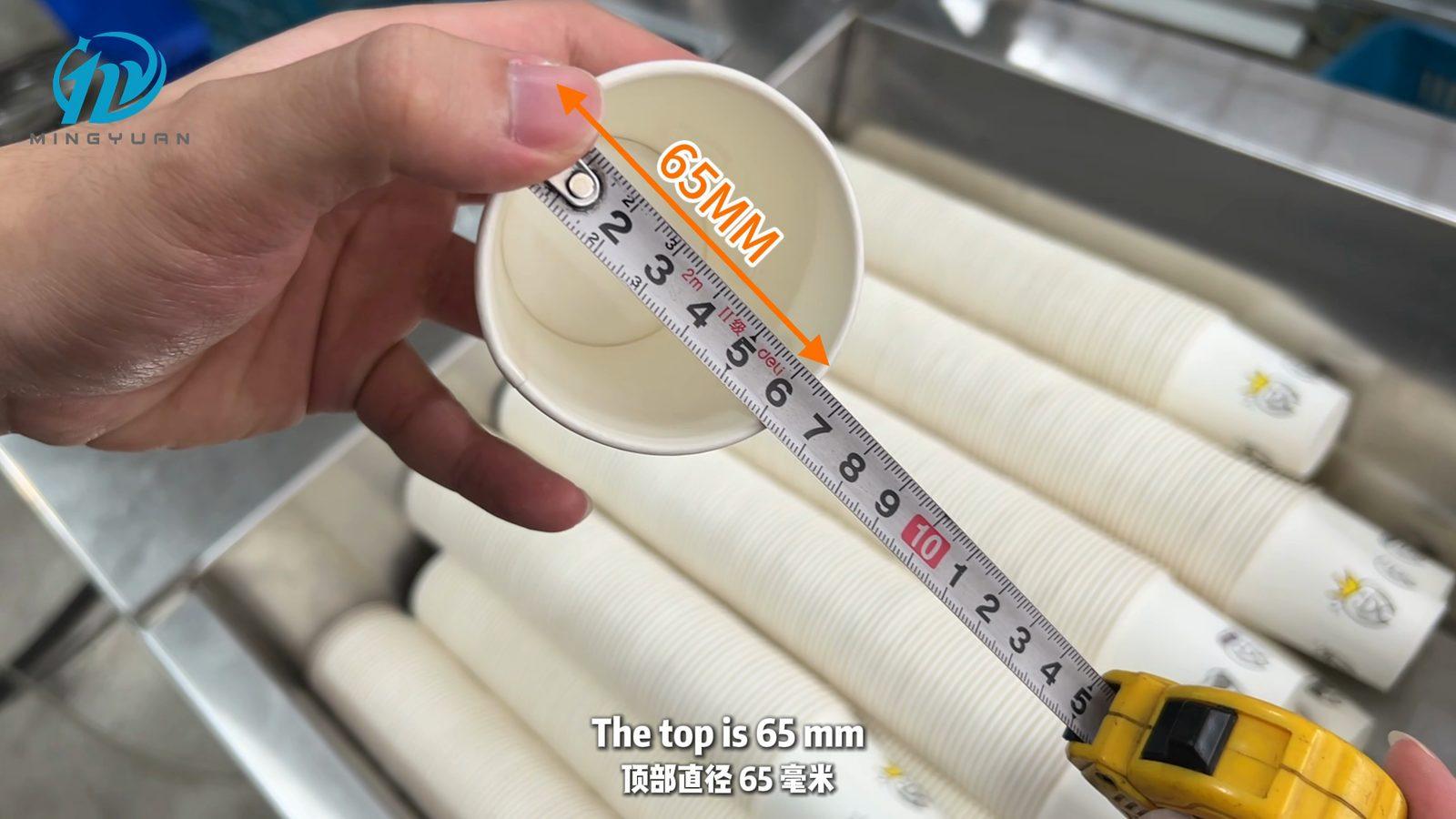 On-camera mouth diameter check of the selected 5 oz coffee cup